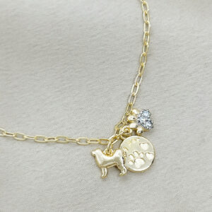 Pulseira My pet com mini patinha cravejada folheada a ouro